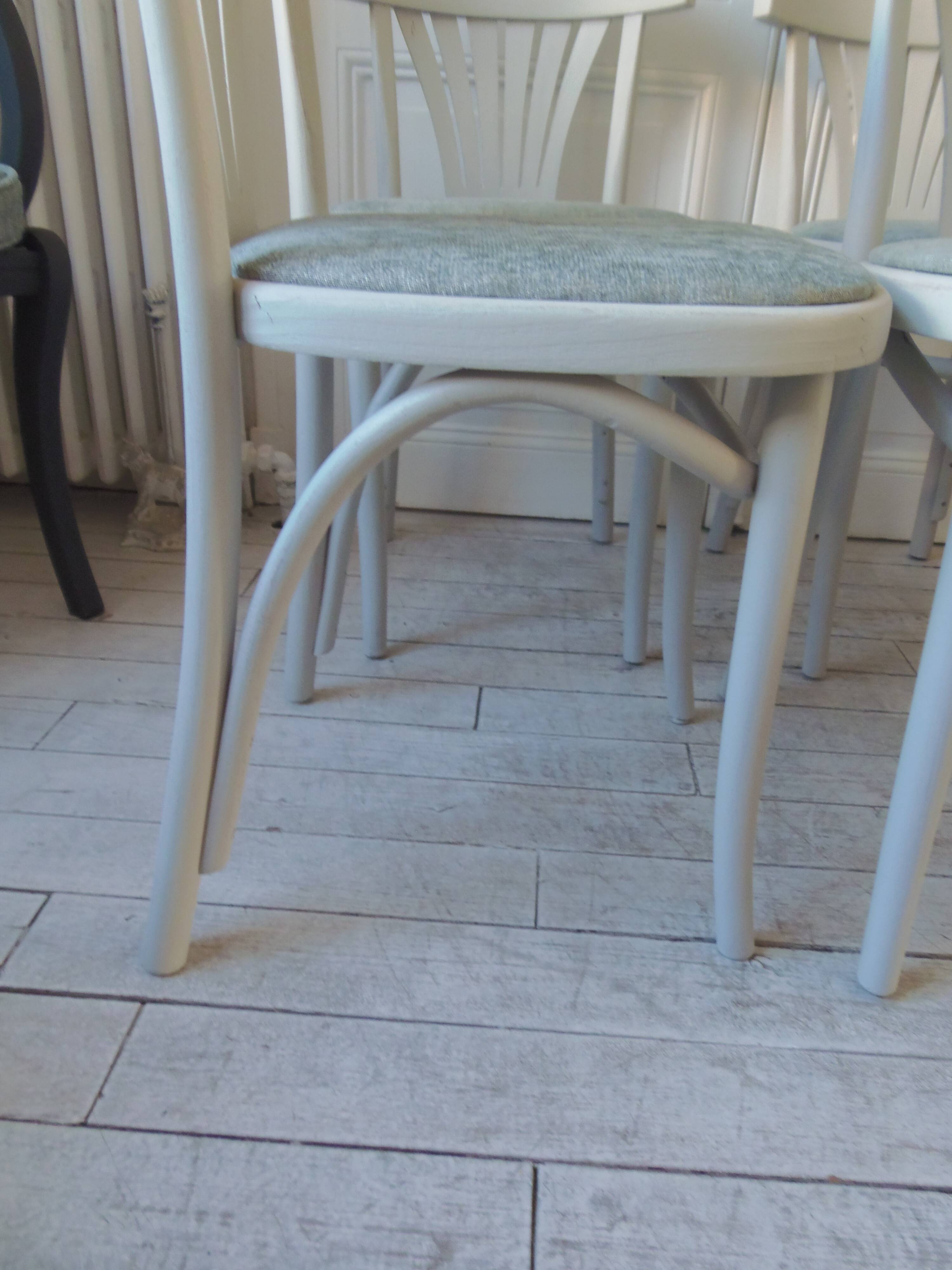 Set of 4 vintage bistro chairs enhanced in pearl grey.