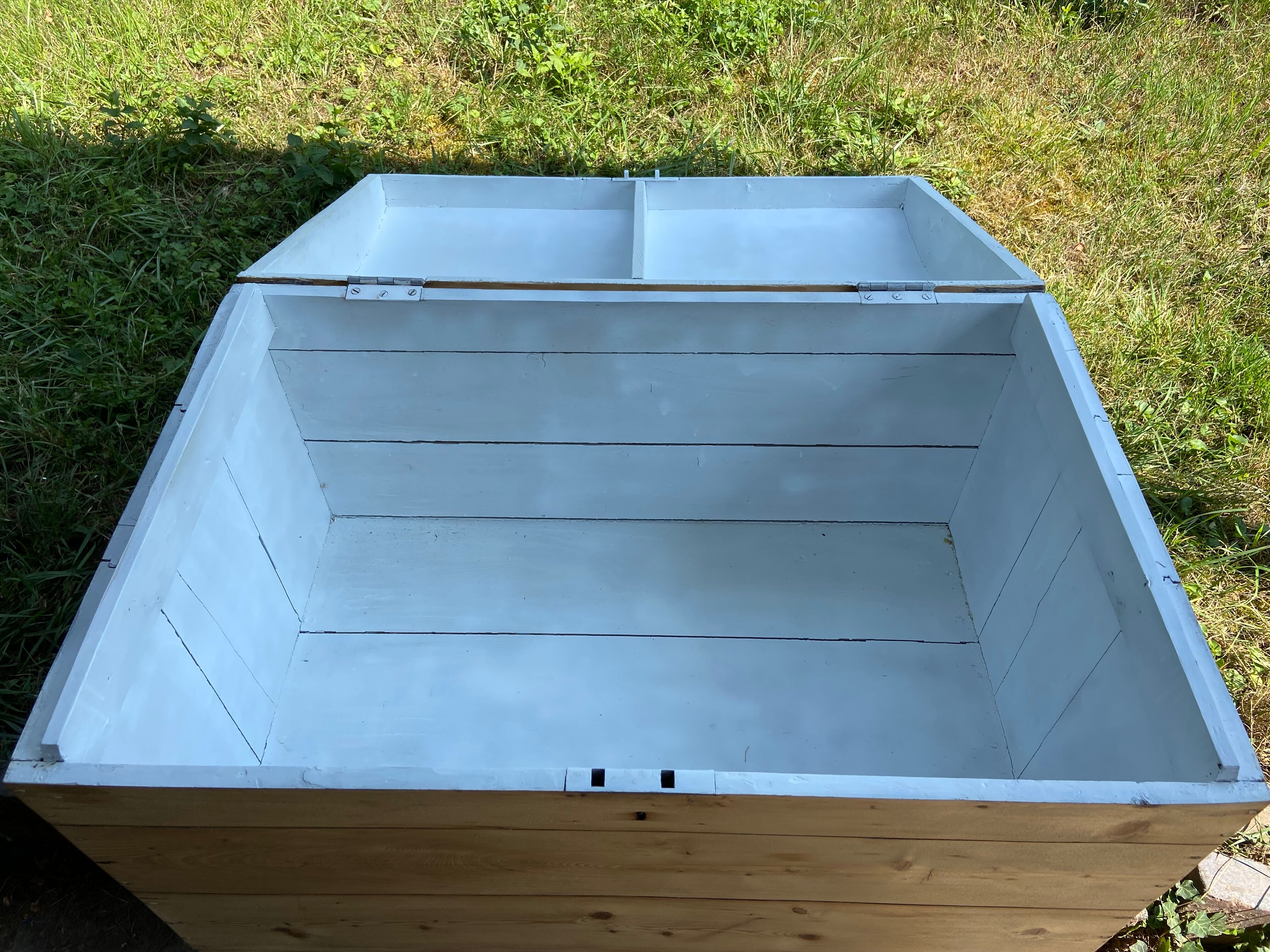 Raw wooden chest with a secret drawer