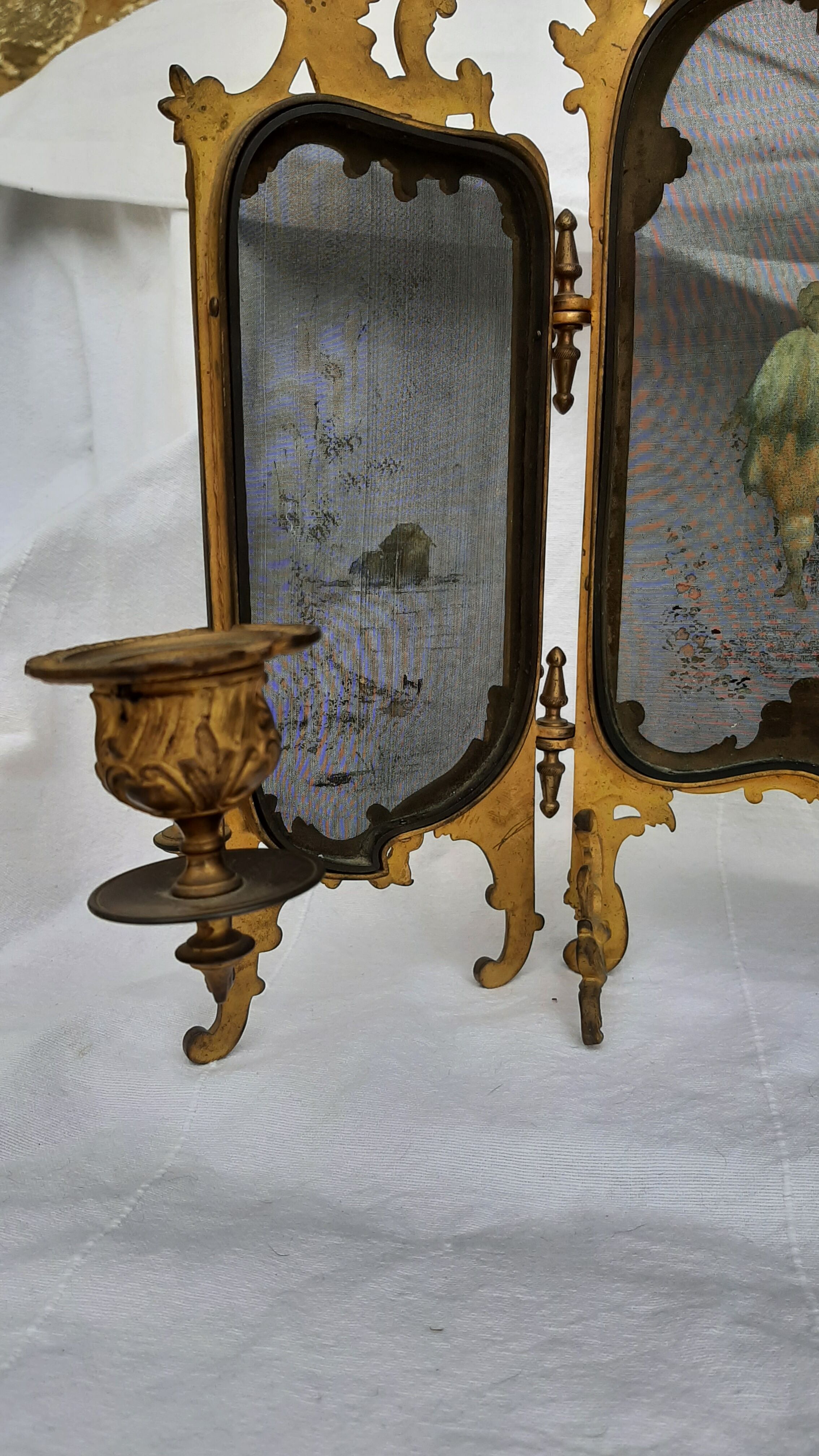 Ancient tryptic in gilded bronze, candlestick