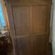 Large wooden display cabinet in Louis XV/rococo style with a strongly curved front.