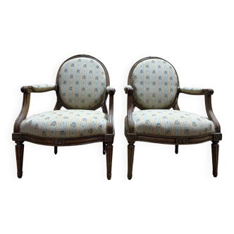 Pair of cabriole armchairs with medallion backs from the Louis XVI period, stamped OT.