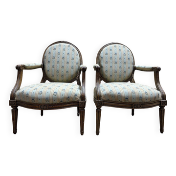 Pair of cabriole armchairs with medallion backs from the Louis XVI period, stamped OT.