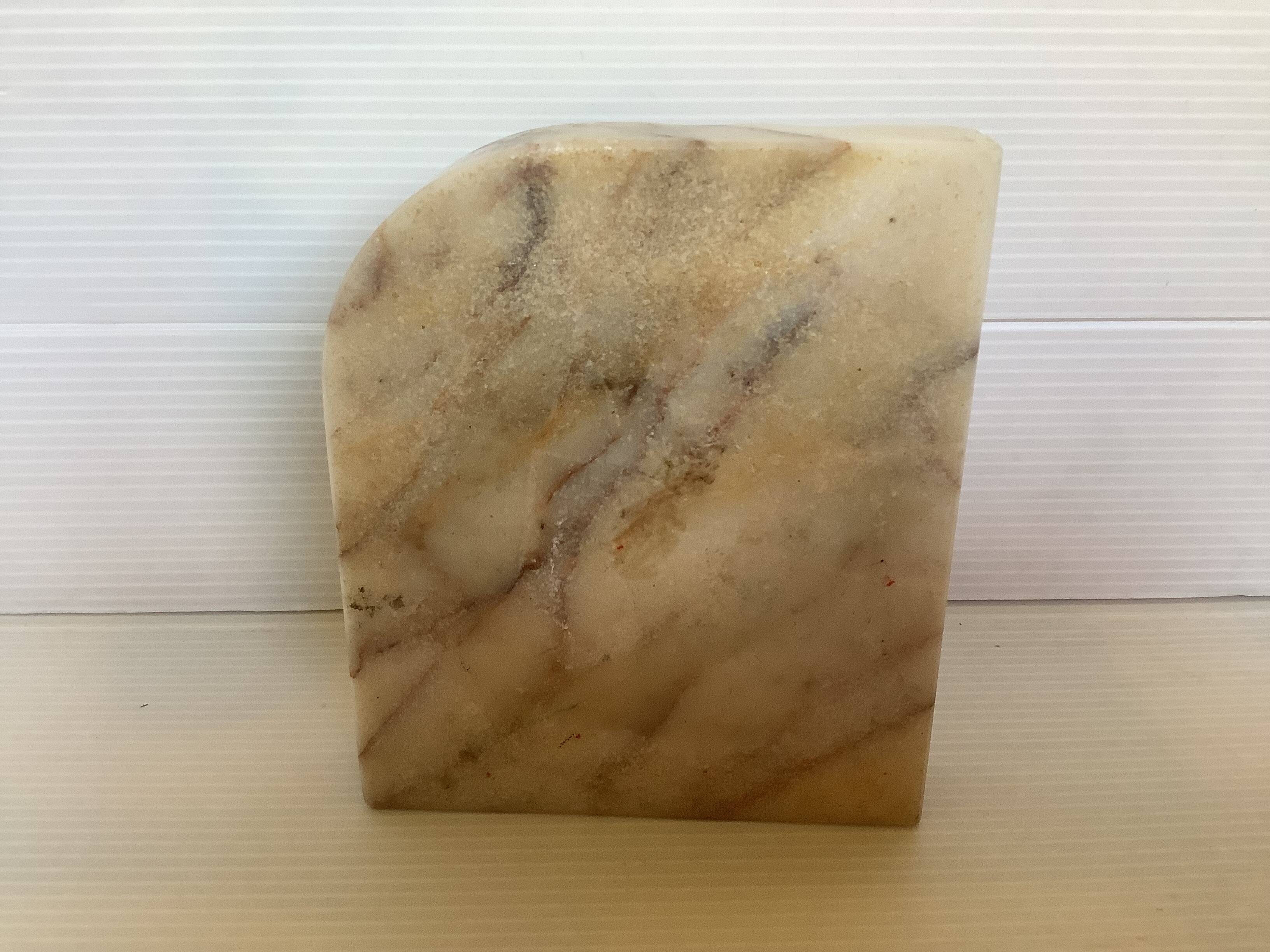 Asymmetrical marble ashtray emptier