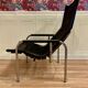 Reclining armchair in black leather and chrome design "hans eichenberger" 1960.