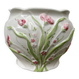 White ceramic pot cache in old flower slip