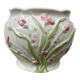 White ceramic pot cache in old flower slip