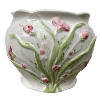 White ceramic pot cache in old flower slip