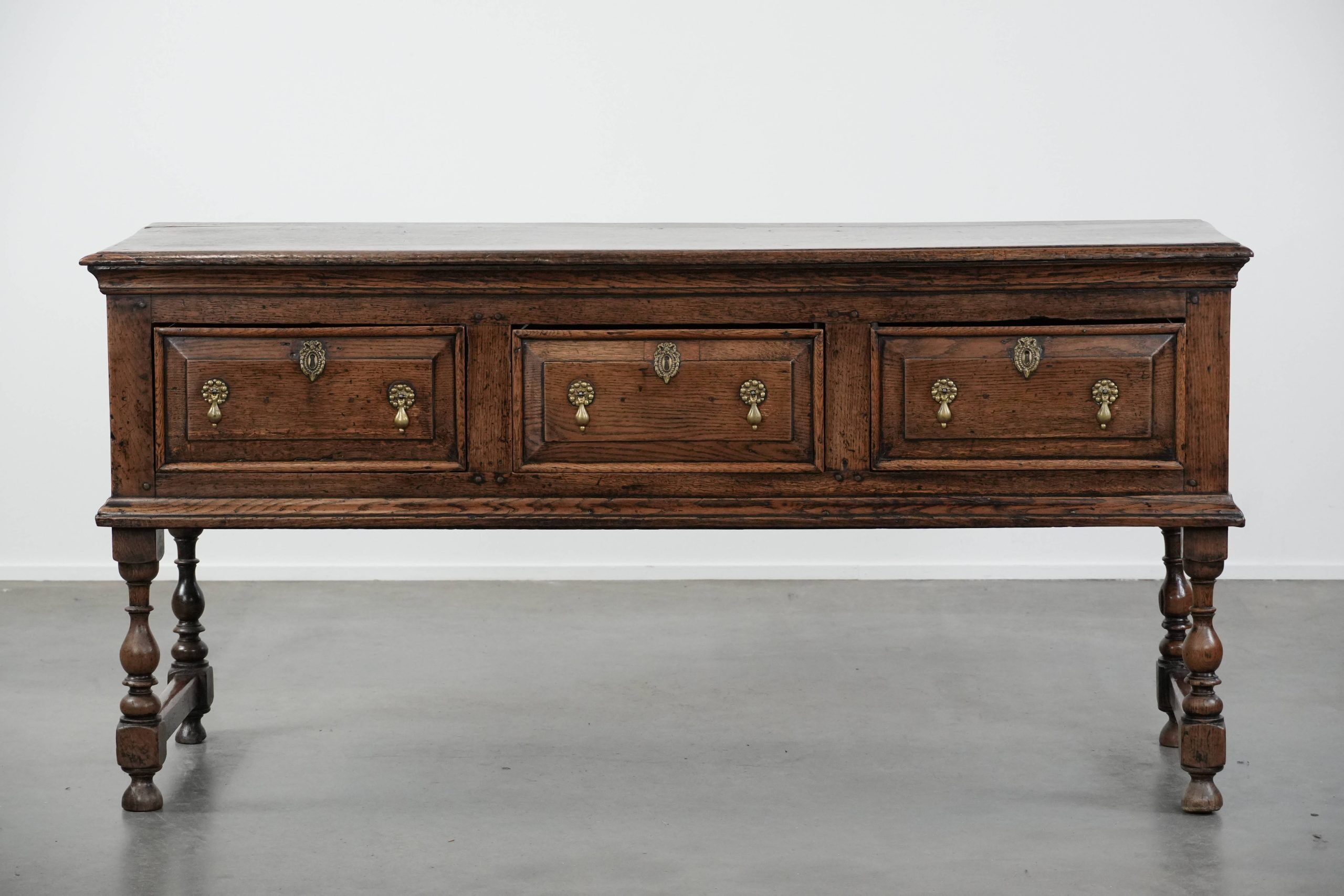 Antique English sideboard from the early 18th century made of oak