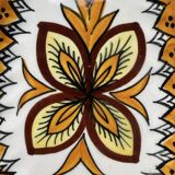 Small wall plate in Henriot Quimper earthenware, floral decoration.