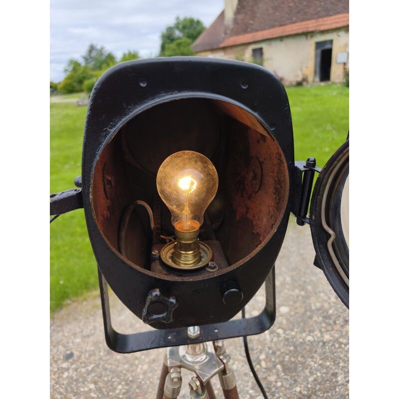 Spotlight on wooden and chrome tripod.