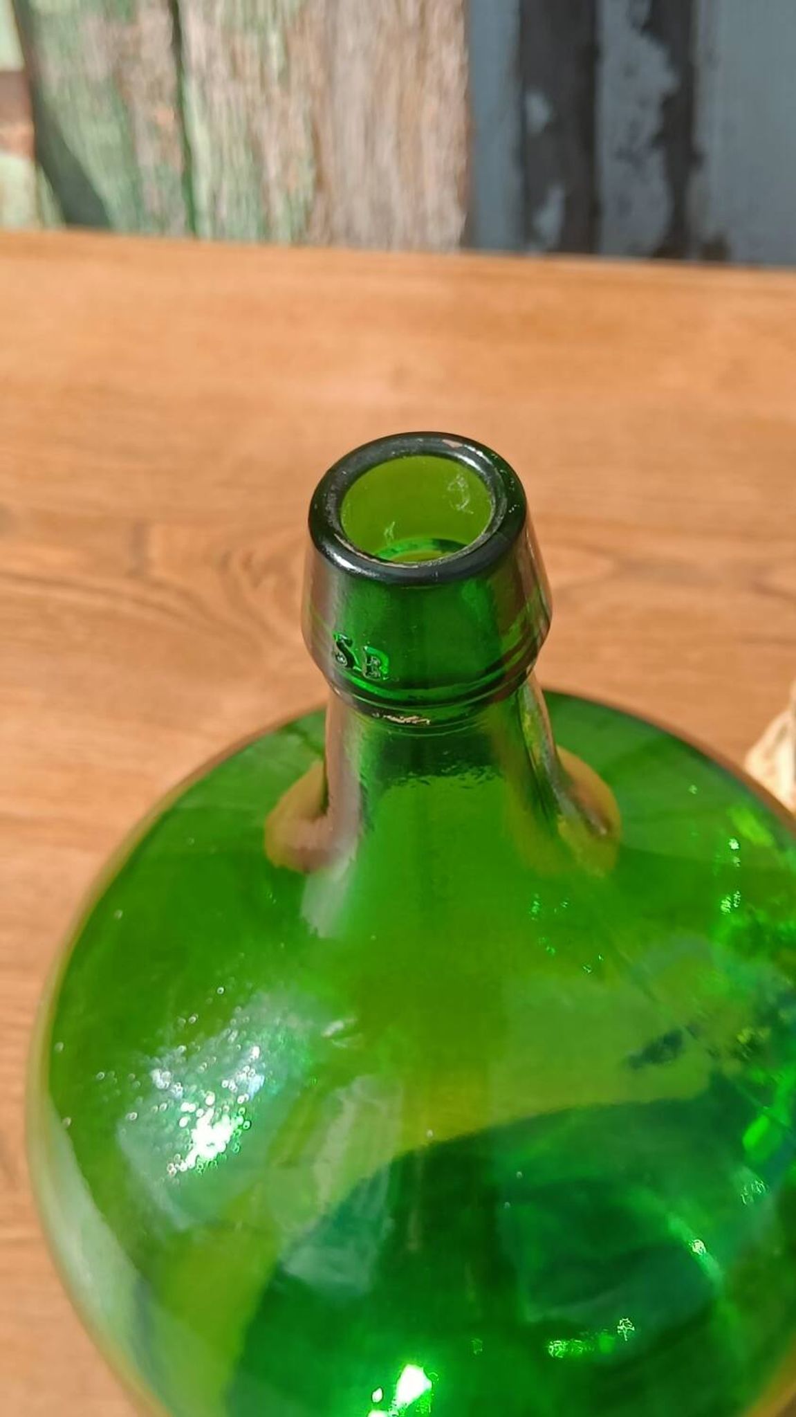 Superb antique green glass demijohn.