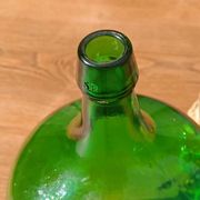 Superb antique green glass demijohn.