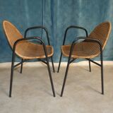 Pair of chairs / vintage armchairs in rattan and black lacquered metal