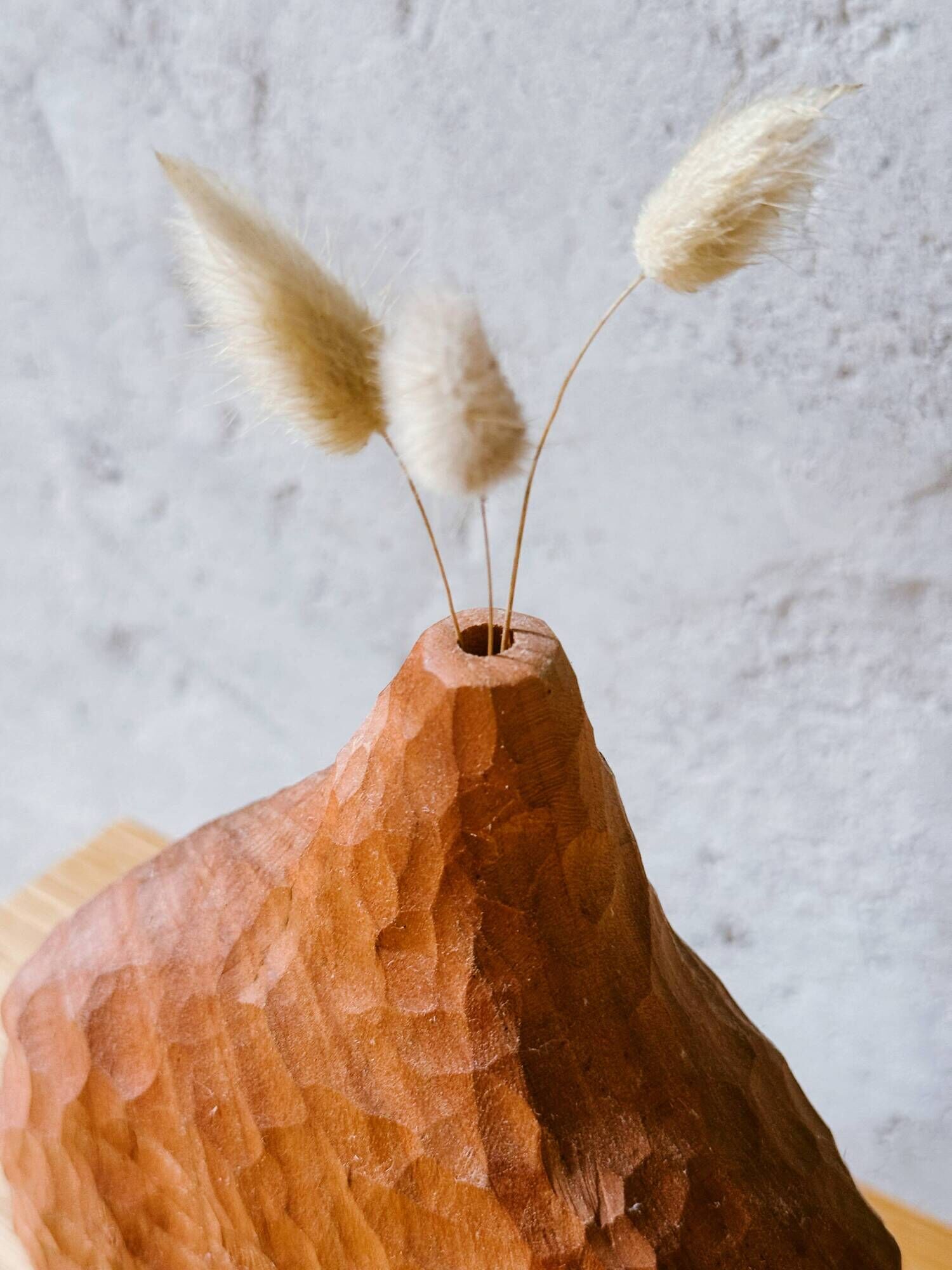 Hand-carved soliflore vase in solid cherry wood.