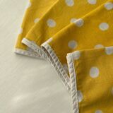 4 yellow napkins with white polka dots