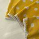 4 yellow napkins with white polka dots