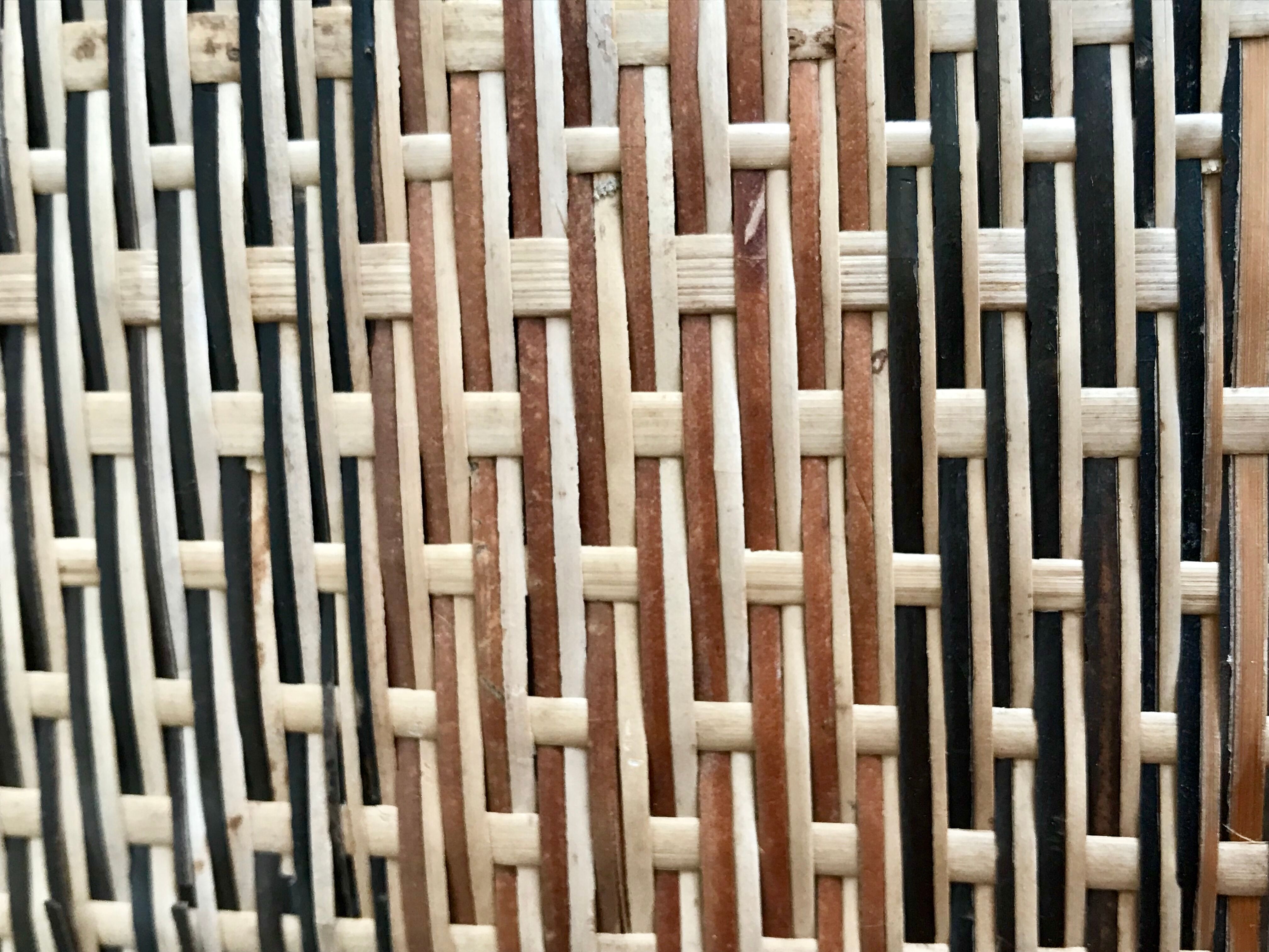 Set of three vintage rattan bottles