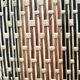 Set of three vintage rattan bottles