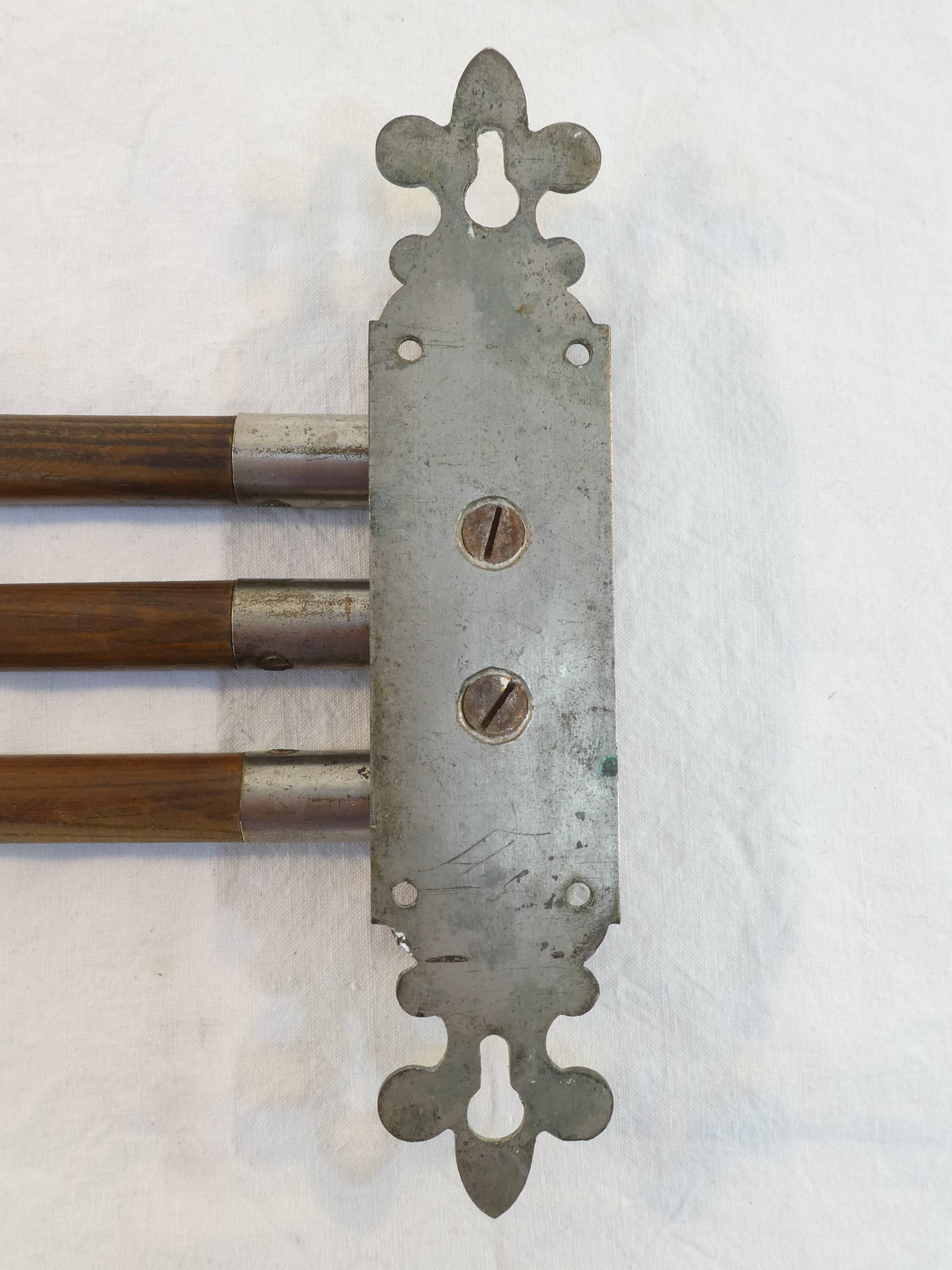 Antique towel rack has three arms