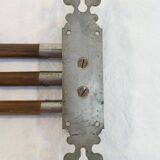 Antique towel rack has three arms