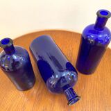 Trio of apothecary bottles in cobalt blue glass