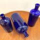 Trio of apothecary bottles in cobalt blue glass