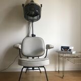 Vintage hairdresser's armchair with helmet transformed into a lamp