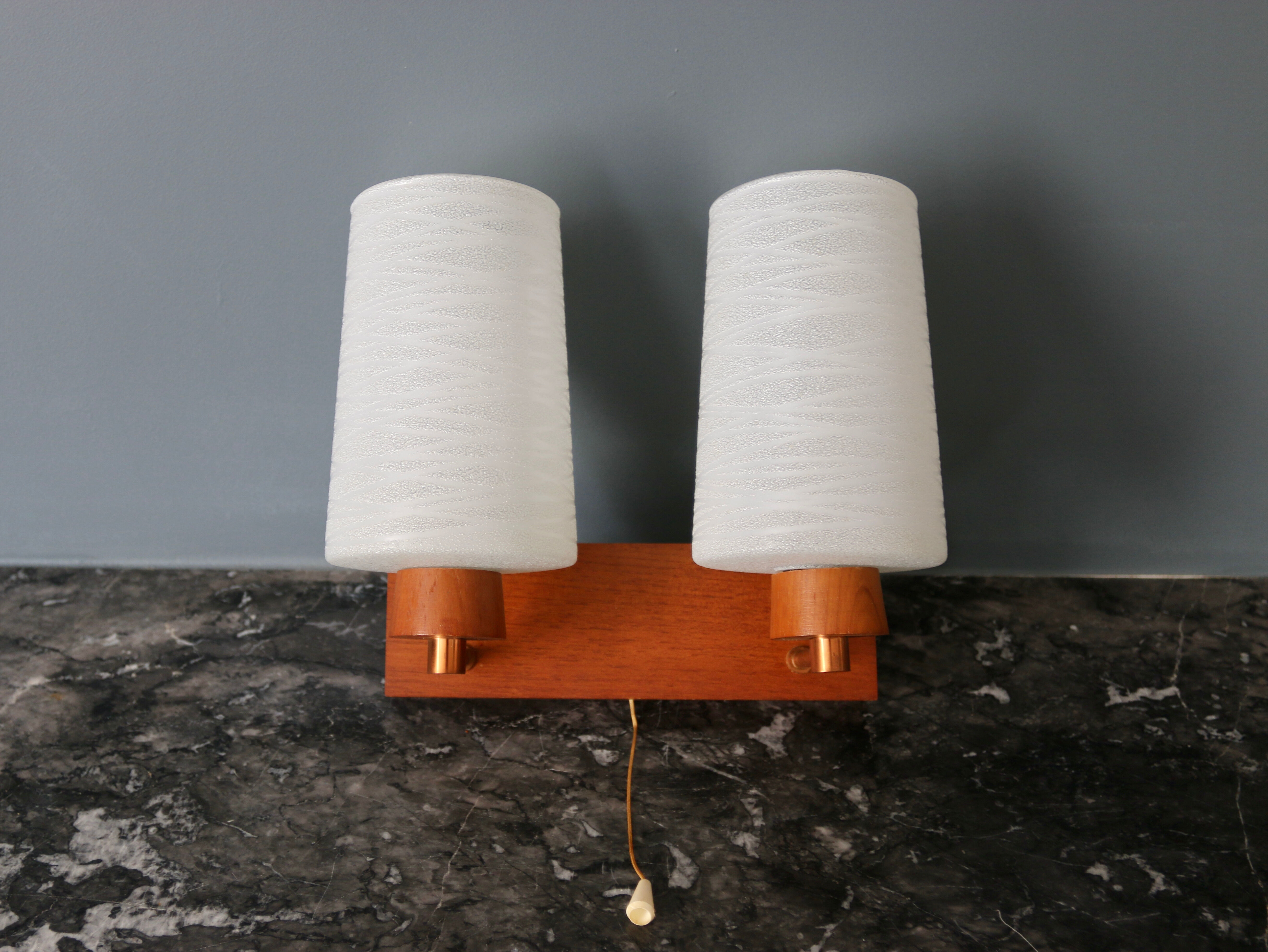 Pair of vintage Scandinavian wall lamps in teak and opaline 1960