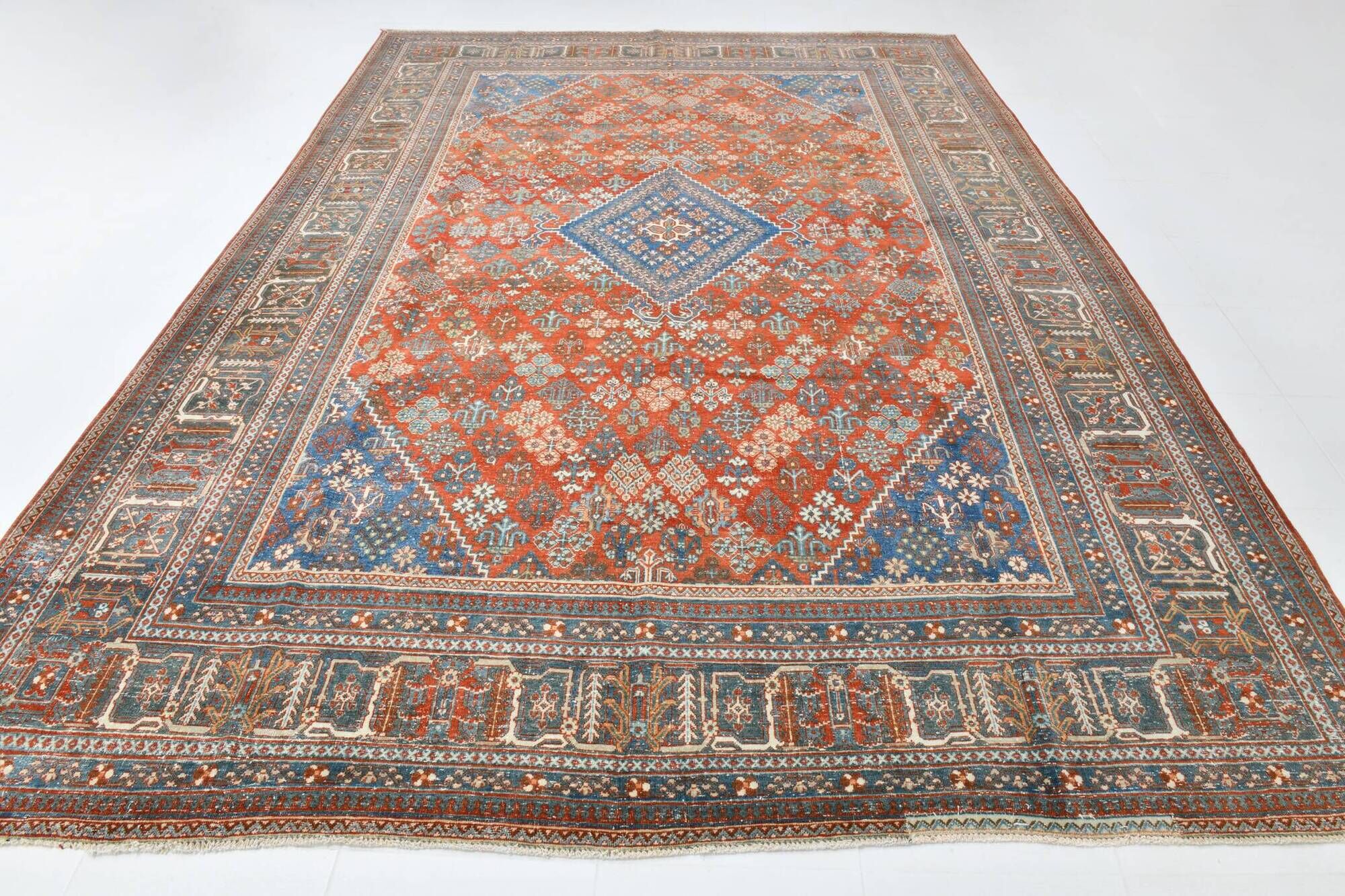 Vintage Turkish rug in brick red and indigo with floral design, 276 × 389 cm