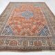 Vintage Turkish rug in brick red and indigo with floral design, 276 × 389 cm