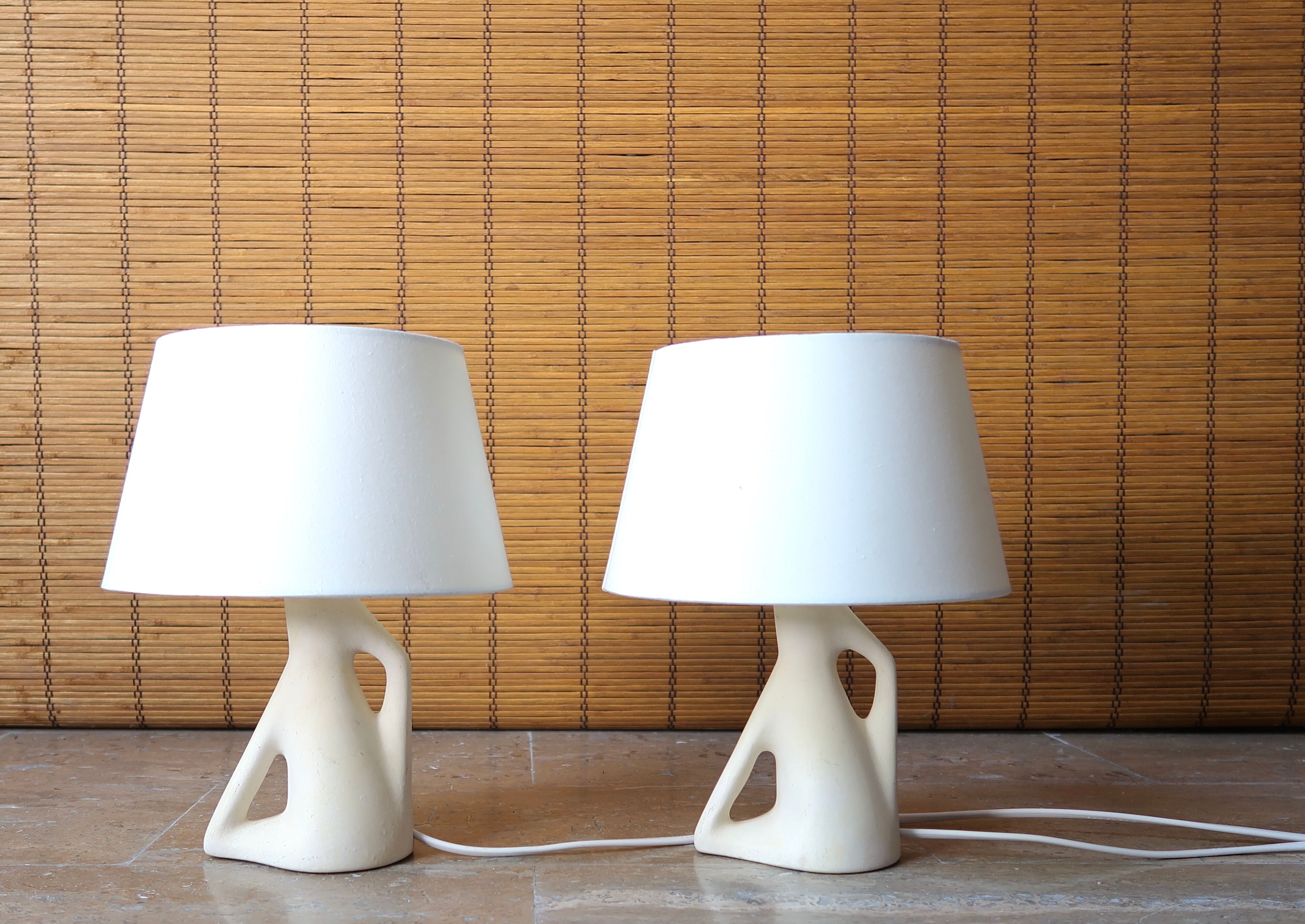 Pair of white ceramic lamps, 50s