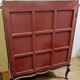 A Louis XV style display cabinet with three beechwood shelves and a white marble top.