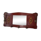 Red wooden wall-mounted coat rack and Art Deco mirror