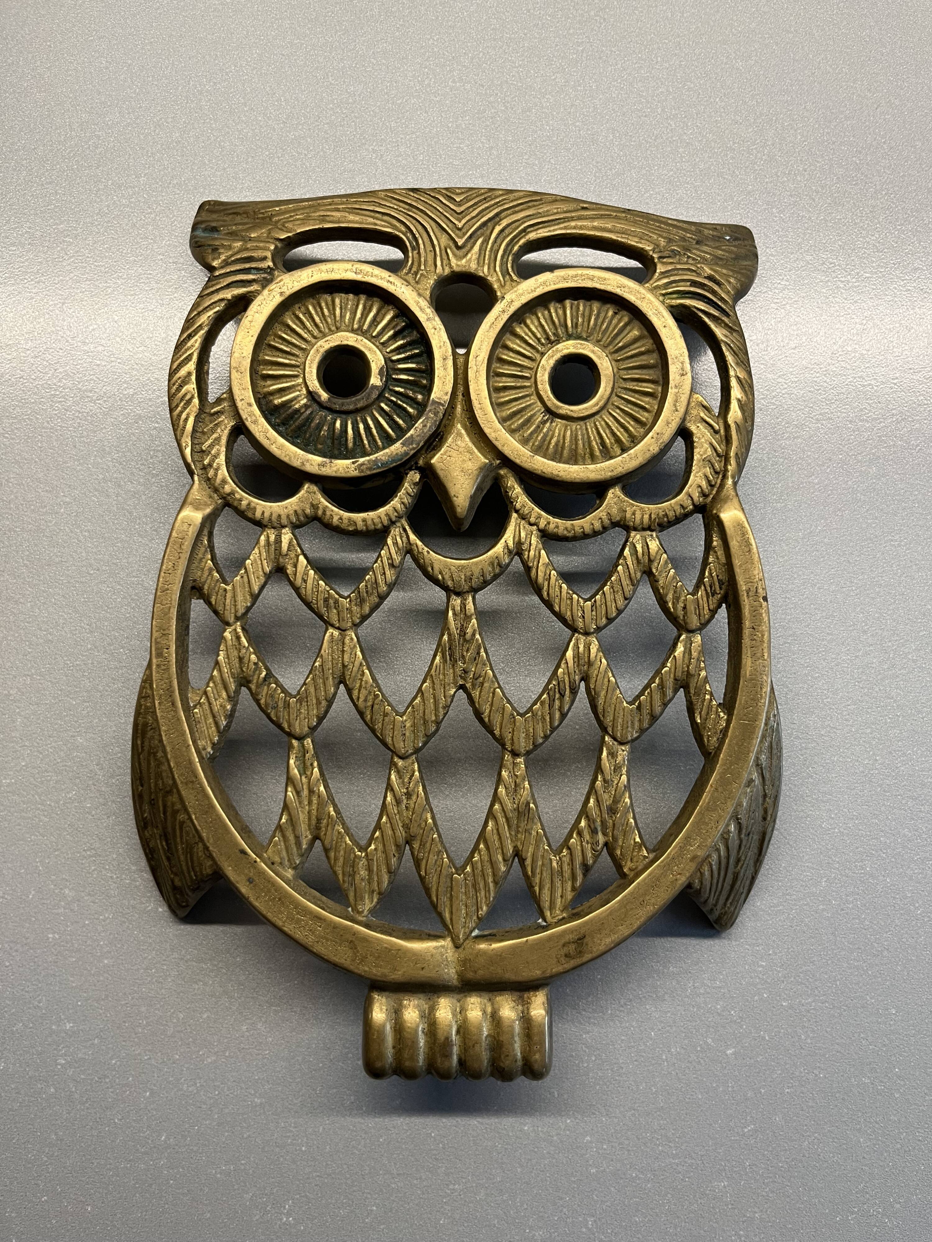 Old brass owl table mat