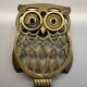 Old brass owl table mat