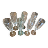 Set of 7 champagne flutes. Made of cut crystal.