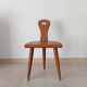 Low brutalist tripod chair in solid oak from the 1960s.