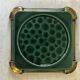 Art Deco bottle coaster in speckled green glazed ceramic and