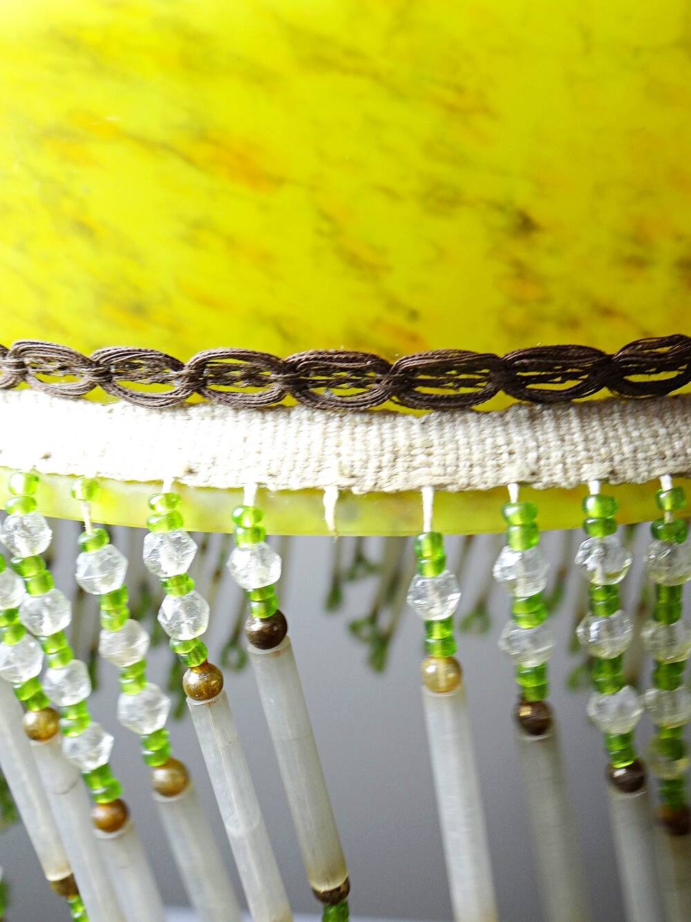 Antique Art Deco lampshade in yellow marbled glass with bead fringes.