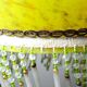Antique Art Deco lampshade in yellow marbled glass with bead fringes.