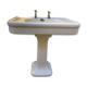 Antique washbasin on ceramic column