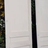 Pair of cupboard doors and old woodwork frame