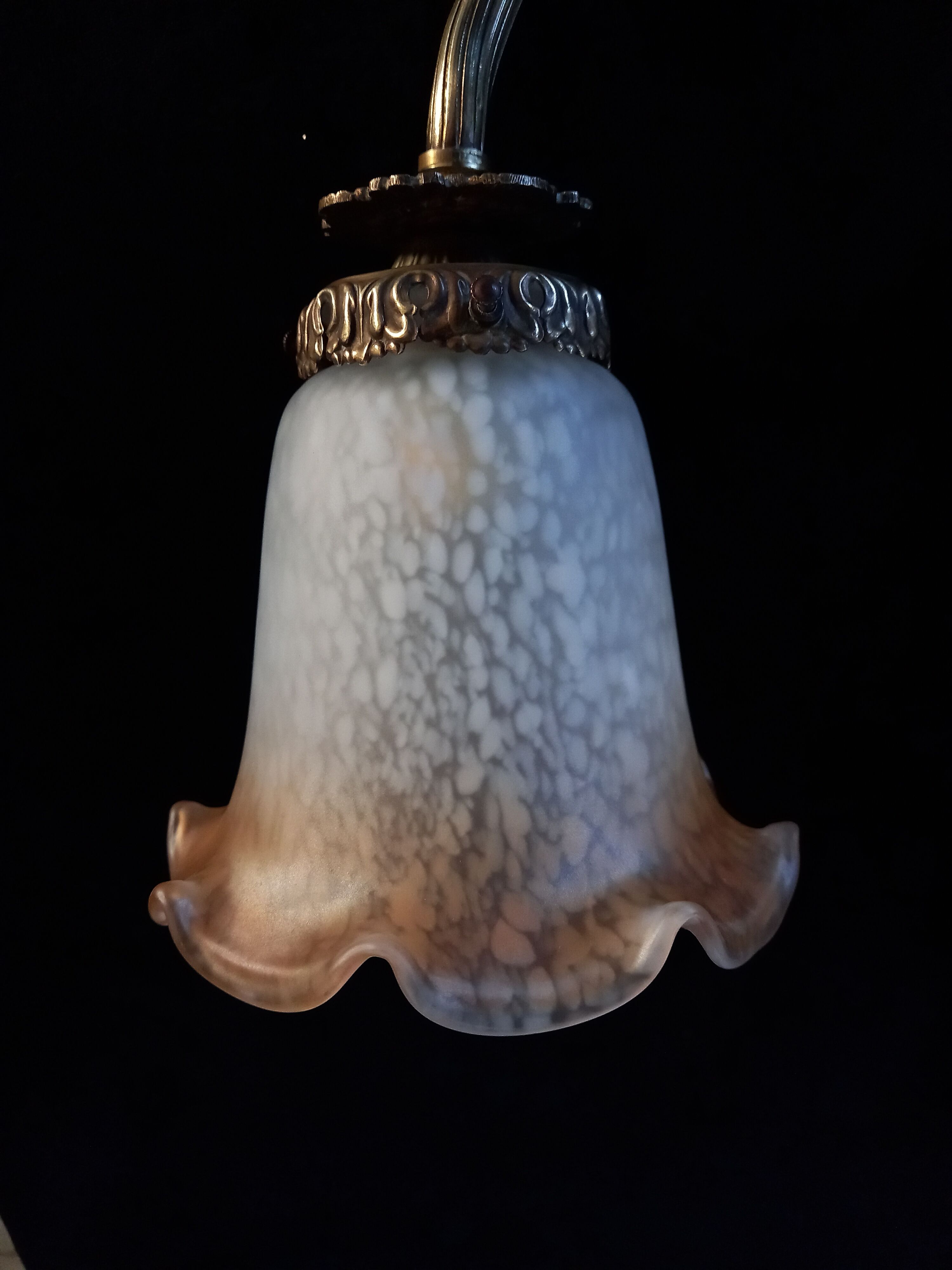 Brass wall lamp with speckled glass tulip