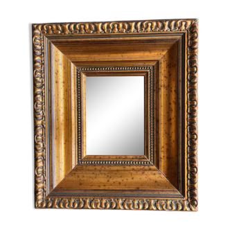 Miroir en bois mouluré doré