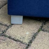 Mid-century blue fabric ottoman stool, 1950s compact modernist design.