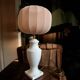 White ceramic table lamp with pastel shade