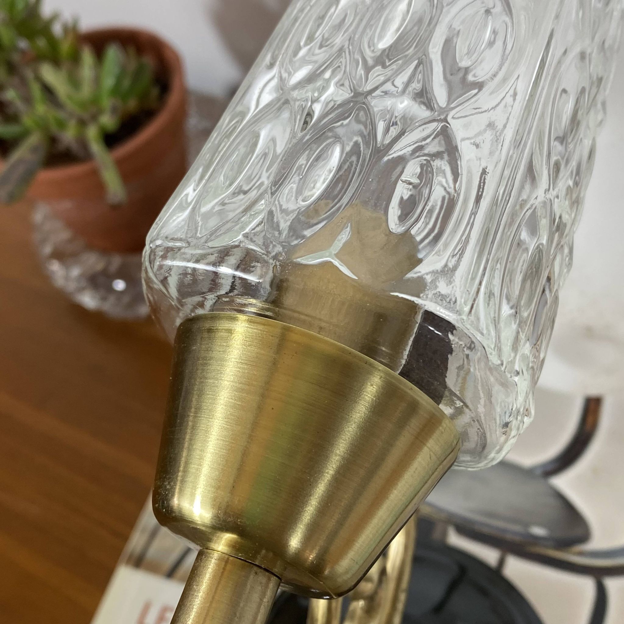 Pair of wall sconces in brass with square tulip glass shades.