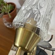 Pair of wall sconces in brass with square tulip glass shades.