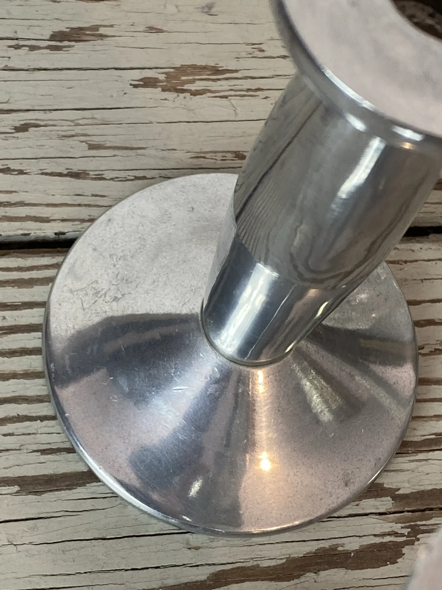 Pair of minimalist polished aluminium candle holders