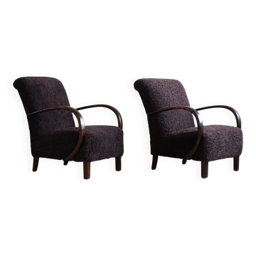 Pair of modern Danish mid-century lounge chairs in beech and lambswool, 1940s.